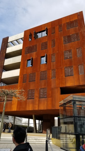 The TC/D1 (Teaching Center and Departments) building at WU Vienna, built with a special material designed to develop a protective "rust" patina over time.